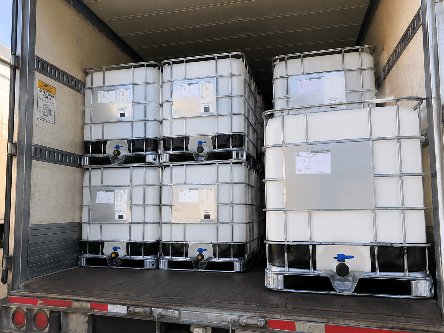 Empty totes being loaded for pickup and transport